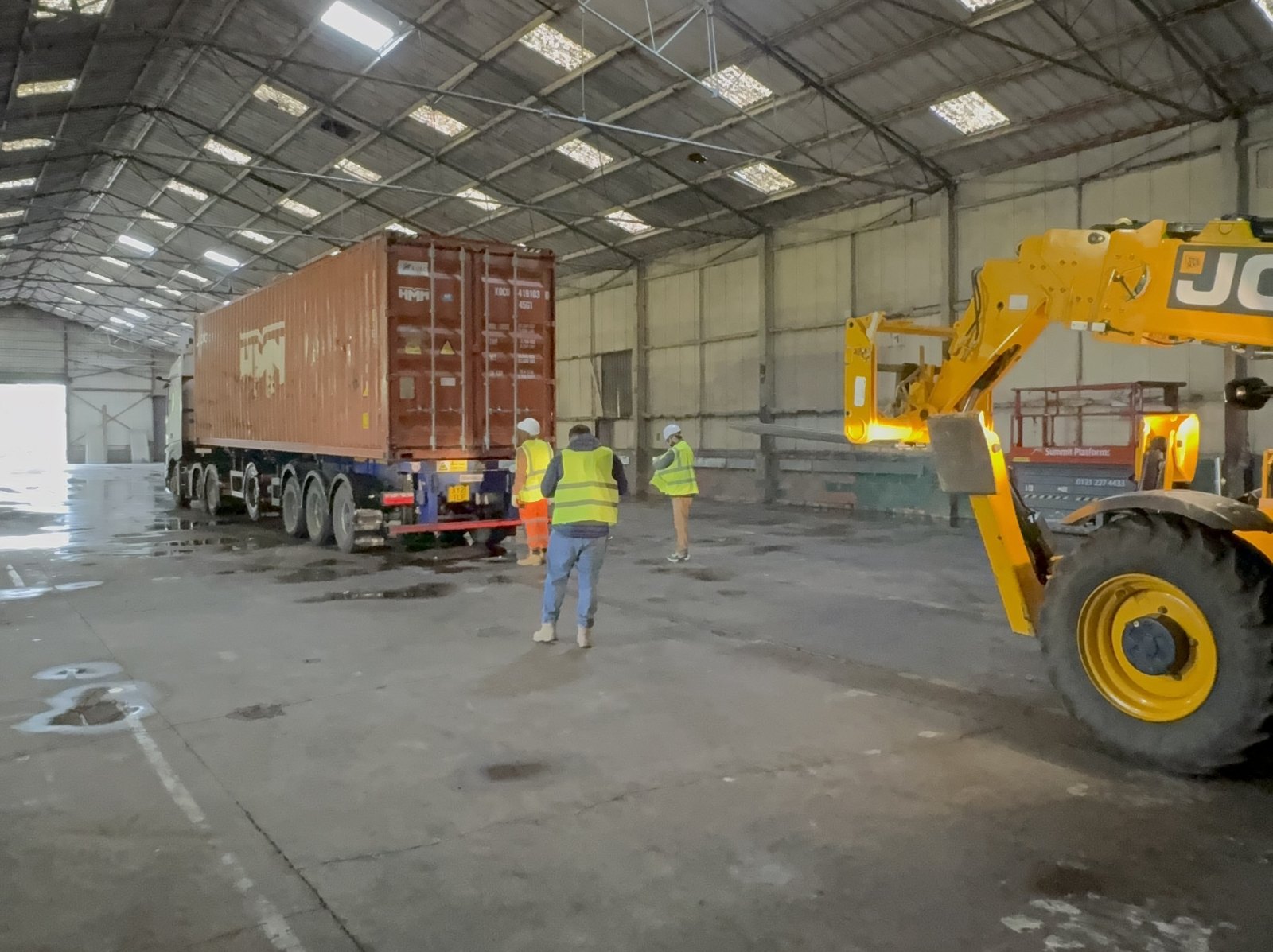 Court materials arriving by container inside the Dome Padel building